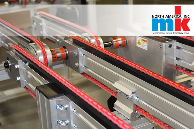 A closeup of a belt conveyor system from mk North America