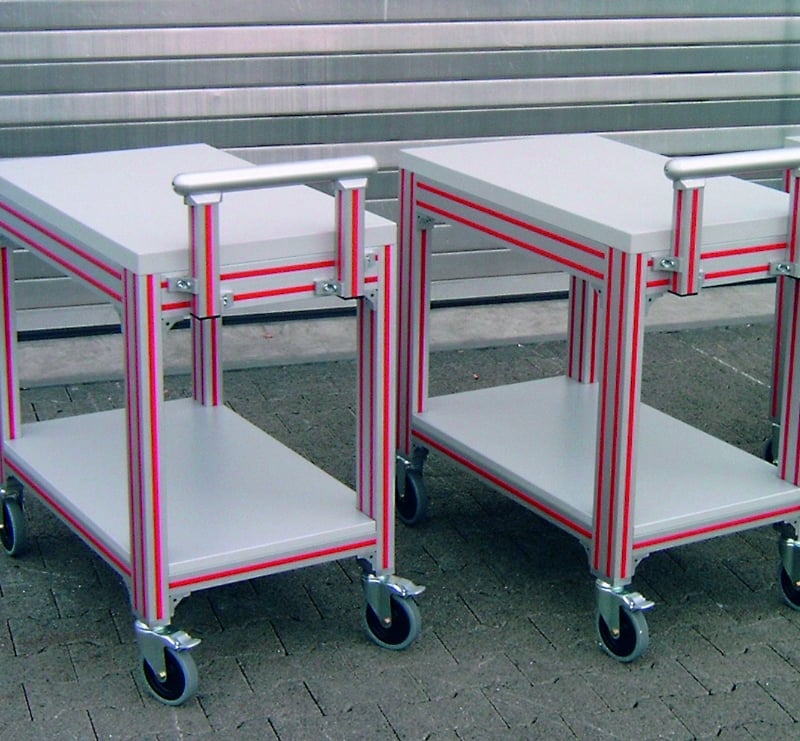 Shop carts with red closure strips in t-slot of aluminum extrusion