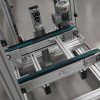 Vertical transfer unit for pallet handling system with timing belt conveyor.