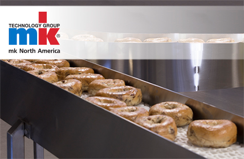Bagels on a stainless steel, BISSC-certified conveyor from mk North America.
