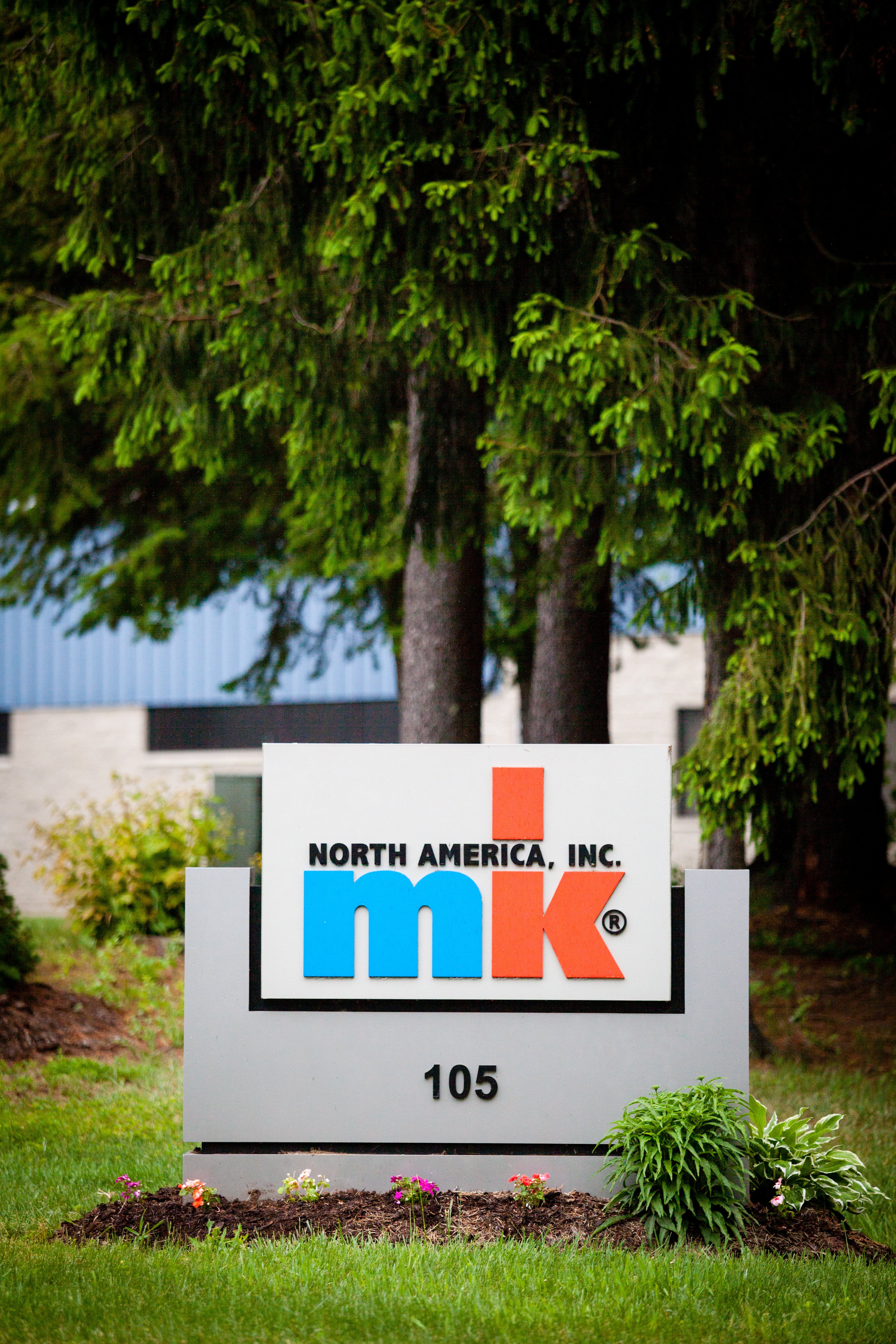 mk North America company sign outside building