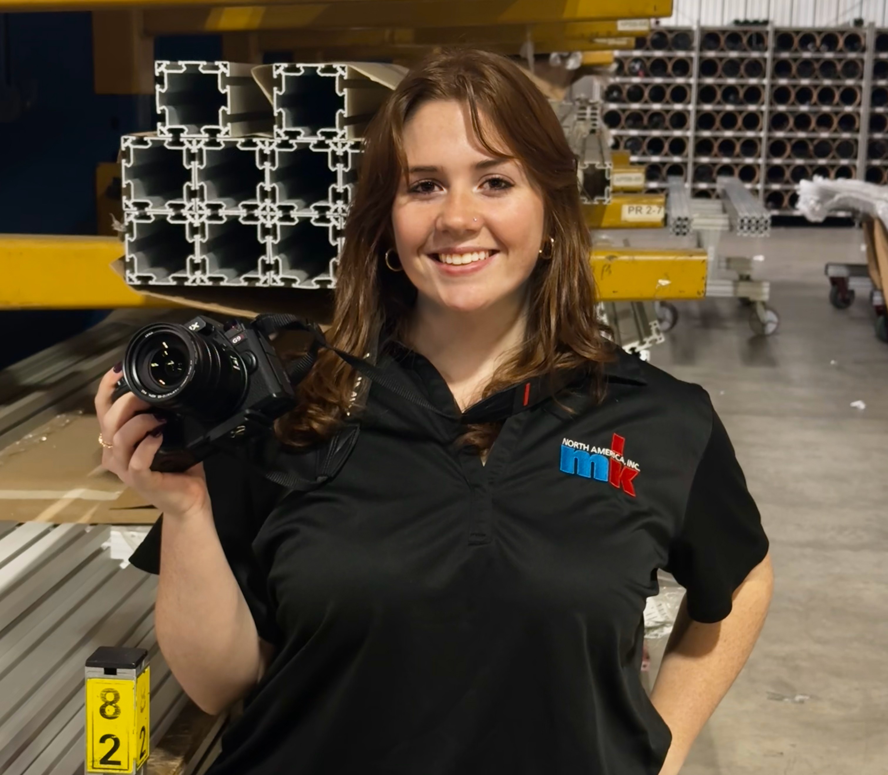 Photographer in manufacturing setting