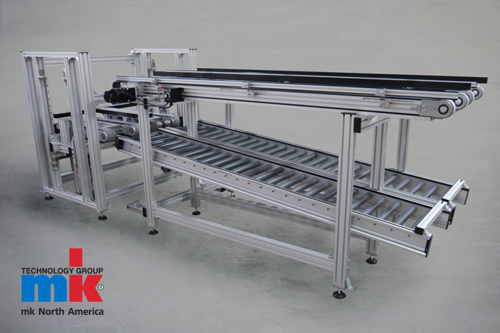 A side photo of an aluminum-frame over under conveyor by mk North America.