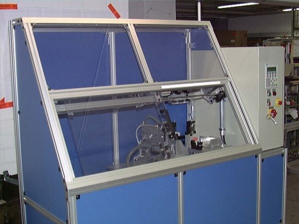 Aluminum extrusion machine guard with blue paneling