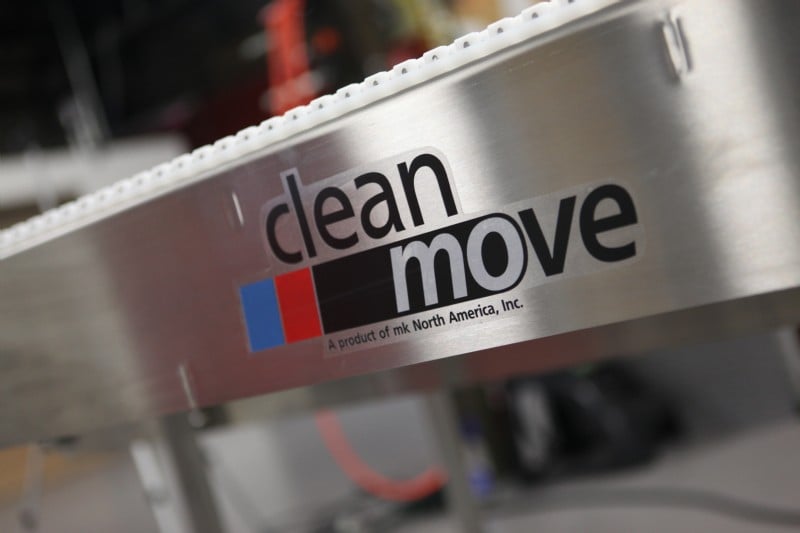 Stainless steel conveyor with CleanMove logo which are made in the USA