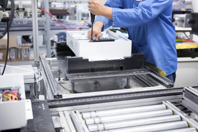 Worker on an automated conveyor line