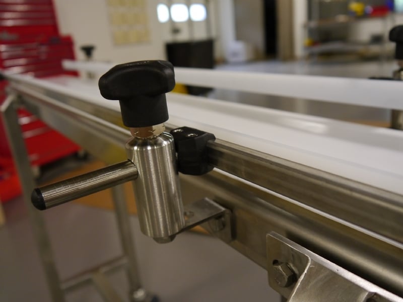 Stainless steel side rail upright on a belt conveyor