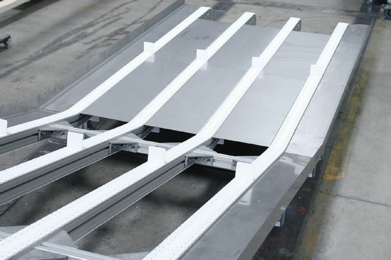 Four lane conveyor with incline and cleats