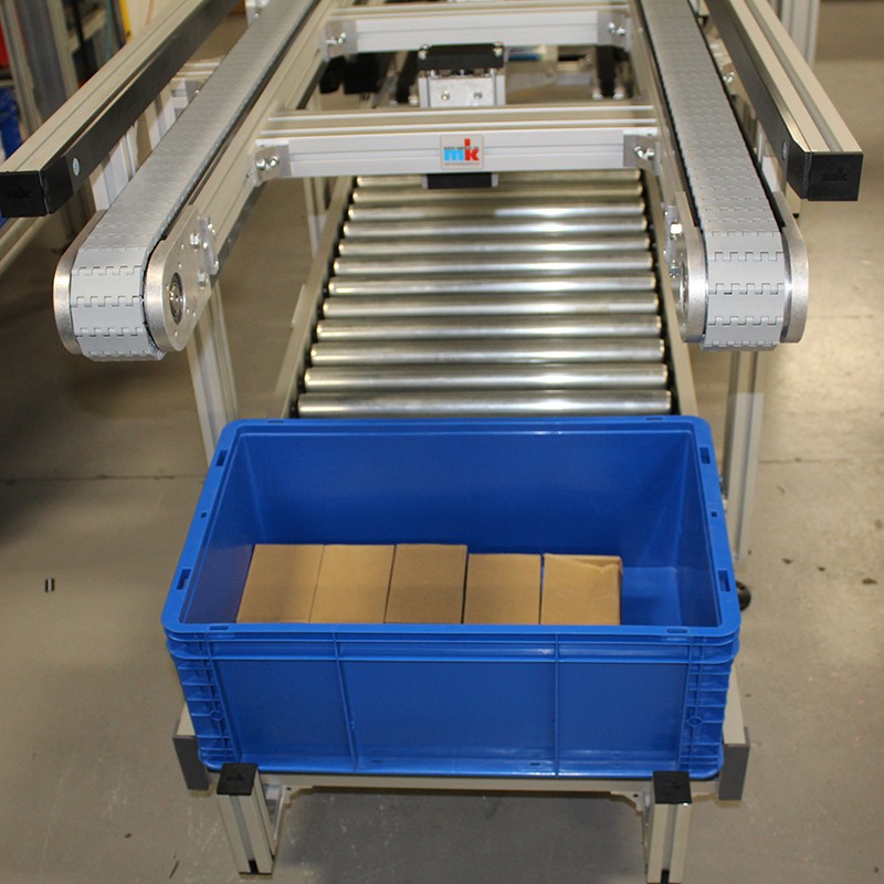 Over under conveyor system with blue tote