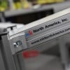 Aluminum frame conveyor with the mk North America logo