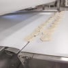 Conveyors, curved, handling biscuit dough over tight trasnfer