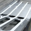 Four lane conveyor with incline and cleats