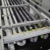 Flexible table top chain conveyor accumulating product