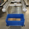 Over under conveyor system with blue tote