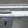 white pallets on a flexible chain conveyor