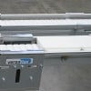 White pallets on a flexible chain conveyor