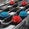 red and blue blows on pallets on conveyors