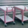 Shop carts with red closure strips in t-slot of aluminum extrusion