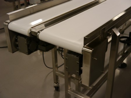 Two stainless steel flat belt conveyors with drive motor