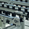 An adjustable width chain conveyor with POM fixtures